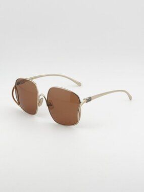 Miu Miu MUA57S ZVN90Q Sunglasses Gold Geometric Frame, Brown Lenses